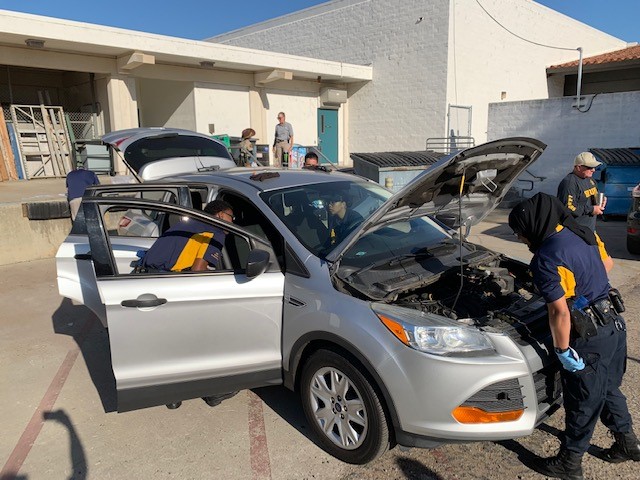 South Sacramento Explorers inspecting a car